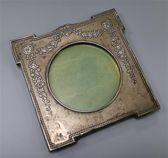 An Edwardian repousse silver photograph frame by William Hutton & Sons, Birmingham, 1906,